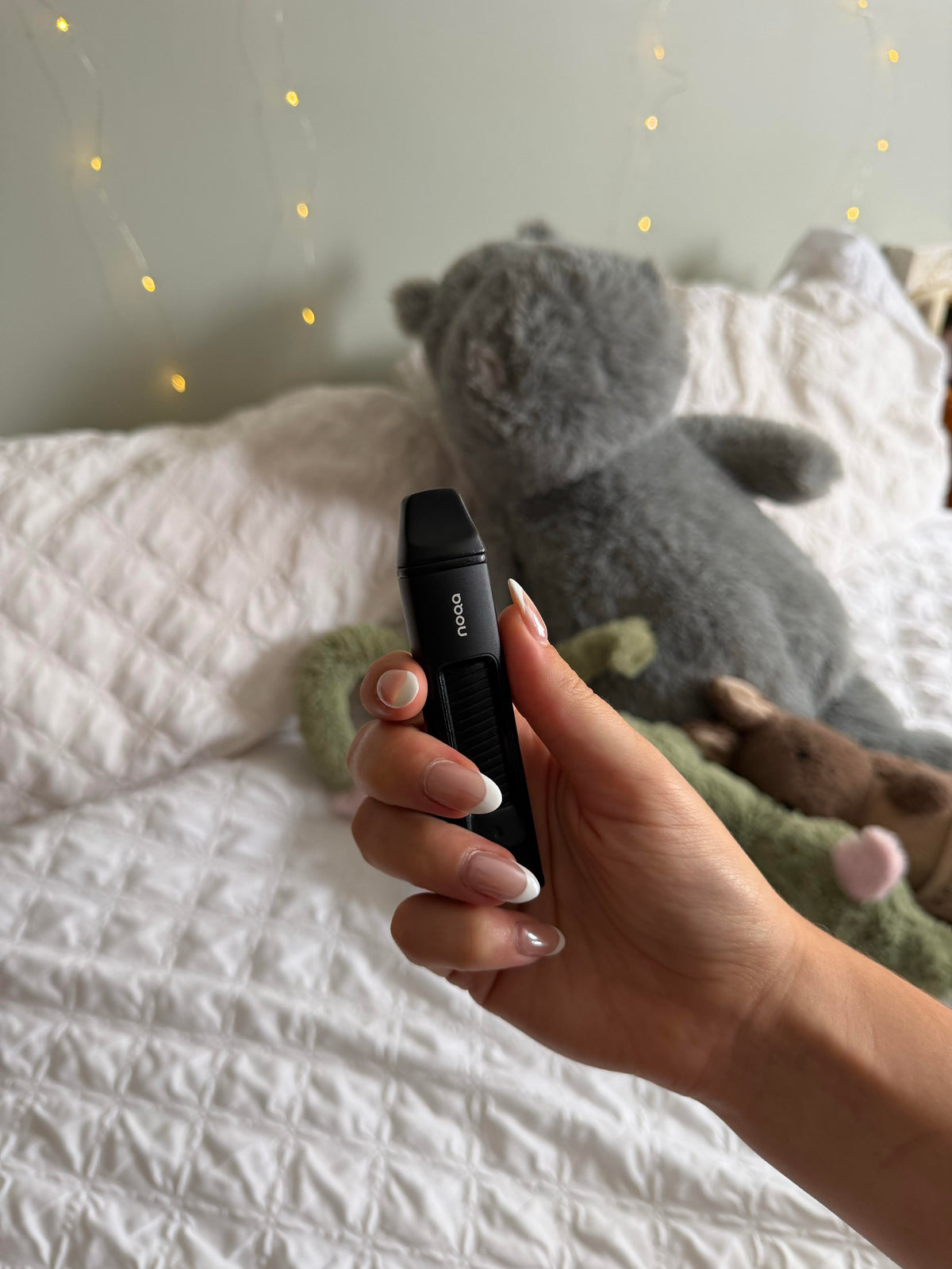Celia, NOQA beta tester, holding her NOQA One nicotine free inhaler